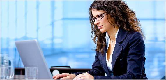 woman looking at her laptop